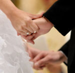 Image of a couple holding hands at a wedding at Yass Valley Anglican Church